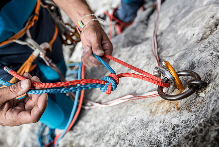 Rappelling, lowering off and descending when alpine climbing
